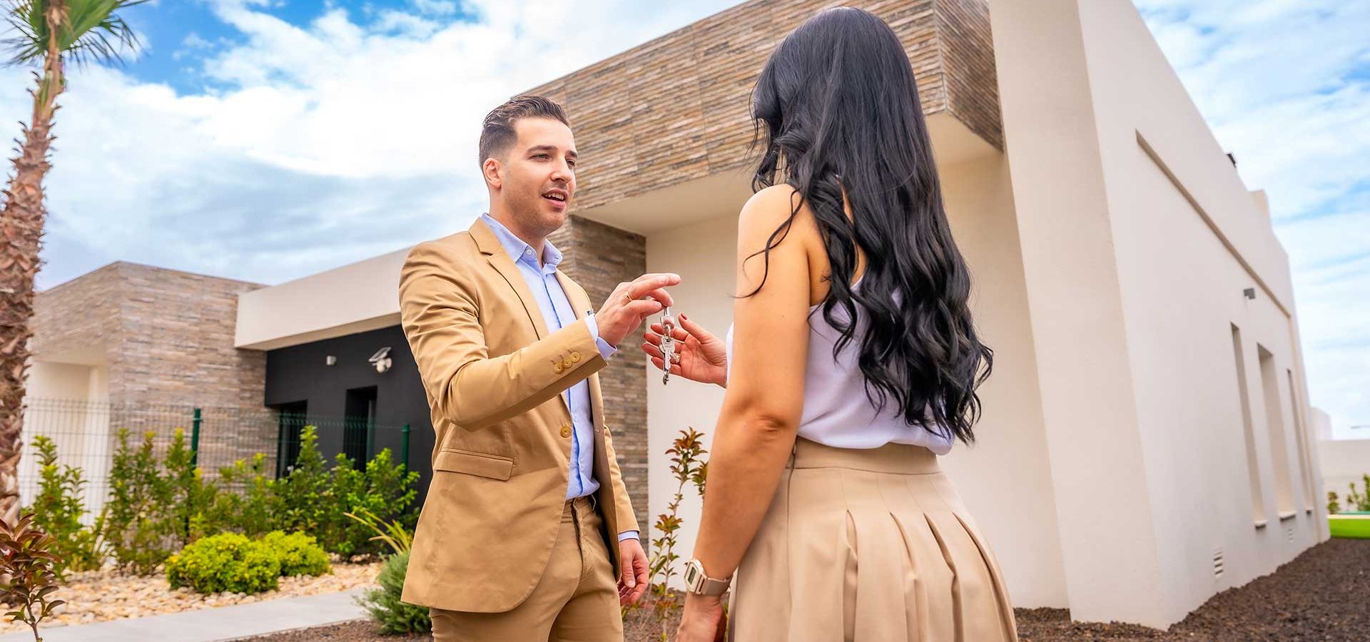 woman-receiving-the-keys-of-a-new-house-CTFF5LY.jpg